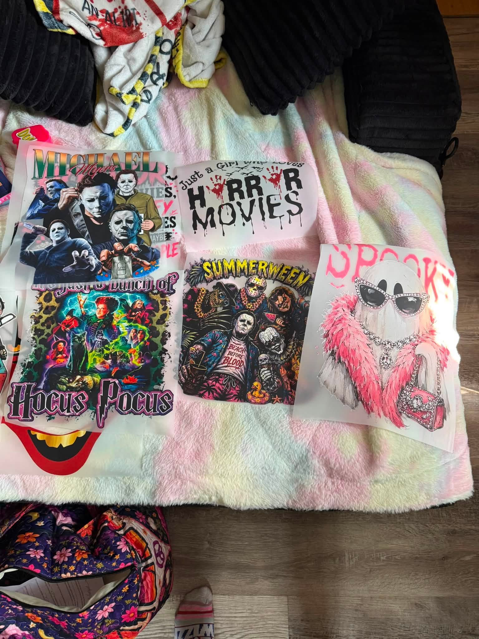 Sheet of colorful DTF transfer designs ready to press onto shirts